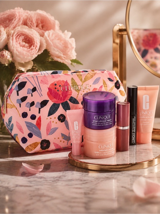 Clinique Other - Clinique Pink Floral Cosmetic Pouch with Skincare & Lip Set new